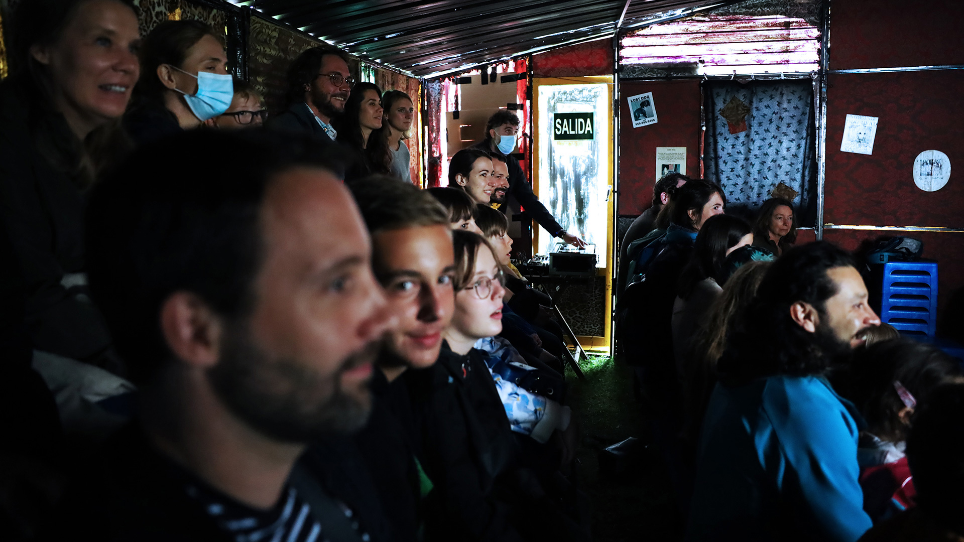 The Lausanne audience inside the "Lost Dog" shanty-house Photo: Noemi Cinelli